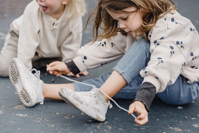 Woman tying her Shoes